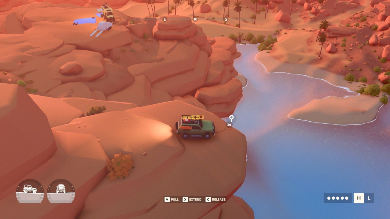 Over The Hill vehicle hanging from winch off cliff in Algeria.